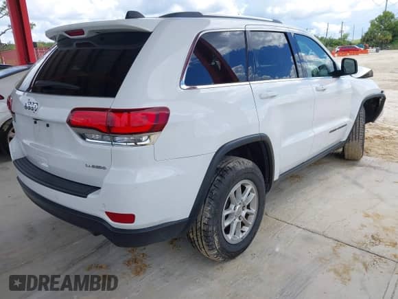 2020 Jeep Grand Cherokee Laredo E with VIN 1C4RJEAG5LC392277, listed as a IAAI auction lot 43310642 with 34,267 mi miles and . Bid and sale history available at DreamBid. Image 4.