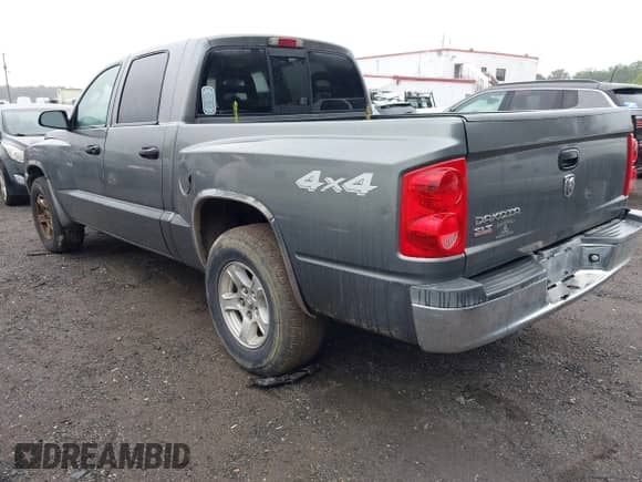 2005 Dodge Dakota SLT with VIN 1D7HW48K05S153798, listed as a IAAI auction lot 42899210 with 165,451 mi miles and . Bid and sale history available at DreamBid. Image 3.