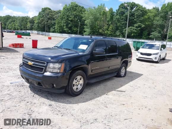 2010 Chevrolet Suburban LT z VIN 1GNUCJE08AR192831, wystawiony jako IAAI lot #42534754 z przebiegiem 165 741 mil mil oraz . Historia ofert i sprzedaży dostępna na DreamBid. Obrazek 18.