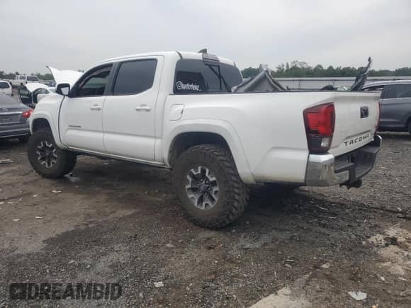 2018 Toyota Tacoma TRD Off Road with VIN 3TMCZ5ANXJM138363, listed as a Copart auction lot 84400805 with 95,418 mi miles and Salvage title. Bid and sale history available at DreamBid. Image 2.