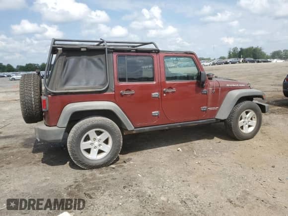 2007 Jeep Wrangler Unlimited Rubicon with VIN 1J8GA69147L164363, listed as a Copart auction lot 66124465 with 142,365 mi miles and Clean title. Bid and sale history available at DreamBid. Image 3.