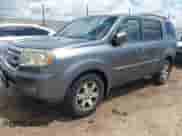 2010 Honda Pilot Touring with VIN 5FNYF3H9XAB008986, listed as a IAAI auction lot 42488828 with 126,662 mi miles and . Bid and sale history available at DreamBid. Image 2.