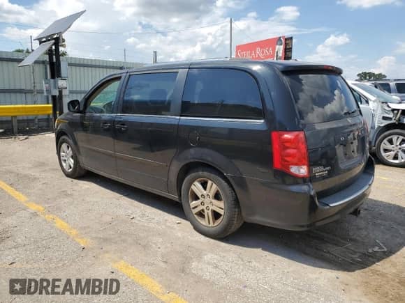 2012 Dodge Grand Caravan Crew with VIN 2C4RDGDG7CR299329, listed as a Copart auction lot 68716235 with 168,908 mi miles and Salvage title. Bid and sale history available at DreamBid. Image 2.