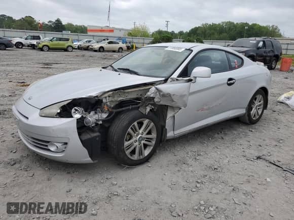 2008 Hyundai Tiburon GS с VIN KMHHM66DX8U288114, выставлен на аукционе Copart как лот 51866995 с пробегом Не указан миль и Списание • Salvage title. История ставок и продаж доступна на DreamBid. Изображение 1.