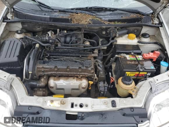 2004 Chevrolet Aveo LS z VIN KL1TJ526X4B240781, wystawiony jako Copart lot #55926015 z przebiegiem 142 173 mil mil oraz Szkoda całkowita • Salvage title. Historia ofert i sprzedaży dostępna na DreamBid. Obrazek 11.