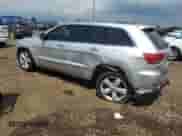 2011 Jeep Grand Cherokee Overland Summit with VIN 1J4RR6GTXBC536210, listed as a Copart auction lot 62634765 with 129,835 mi miles and Salvage title. Bid and sale history available at DreamBid. Image 2.