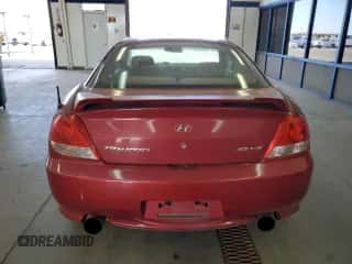 2006 Hyundai Tiburon GT with VIN KMHHN65F06U212592, listed as a Copart auction lot 71478344 with 121,574 mi miles and Salvage title. Bid and sale history available at DreamBid. Image 6.
