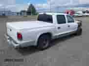 2002 Dodge Dakota SLT with VIN 1B7HL48N42S607446, listed as a IAAI auction lot 42303573 with 250,601 mi miles and . Bid and sale history available at DreamBid. Image 4.