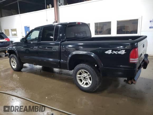 2003 Dodge Dakota Sport z VIN 1D7HG38X23S299507, wystawiony jako Copart lot #67698734 z przebiegiem 146 696 mil mil oraz Szkoda całkowita • Salvage title. Historia ofert i sprzedaży dostępna na DreamBid. Obrazek 2.