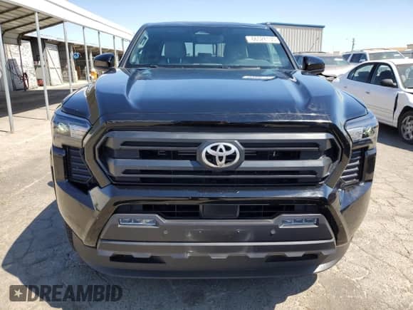 2024 Toyota Tacoma SR5 with VIN 3TMLB5JNXRM054298, listed as a Copart auction lot 66528135 with 5,976 mi miles and Salvage title. Bid and sale history available at DreamBid. Image 5.