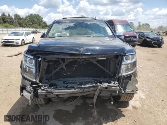 2016 Chevrolet Tahoe LTZ with VIN 1GNSKCKCXGR363902, listed as a Copart auction lot 63211395 with 154,421 mi miles and Salvage title. Bid and sale history available at DreamBid. Image 5.