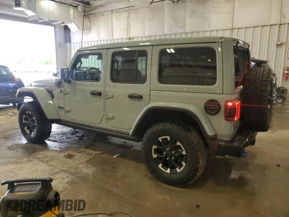 2024 Jeep Wrangler Rubicon with VIN 1C4RJXR66RW100859, listed as a Copart auction lot 58377805 with 9,426 mi miles and Salvage title. Bid and sale history available at DreamBid. Image 2.
