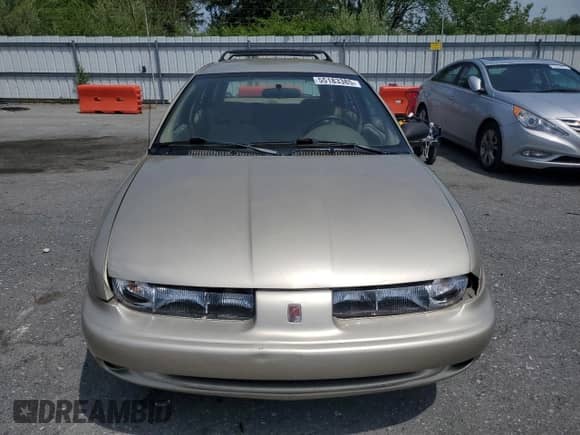1999 Saturn SW with VIN 1G8ZJ827XXZ323713, listed as a Copart auction lot 55183385 with 166,834 mi miles and Salvage title. Bid and sale history available at DreamBid. Image 5.