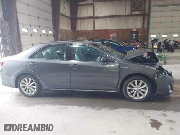 2014 Toyota Camry LE z VIN 4T1BD1FK0EU098485, wystawiony jako IAAI lot #43305714 z przebiegiem 69 977 mil mil oraz . Historia ofert i sprzedaży dostępna na DreamBid. Obrazek 13.