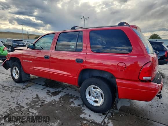1999 Dodge Durango with VIN 1B4HS28Y8XF665252, listed as a Copart auction lot 84897495 with 173,078 mi miles and Salvage title. Bid and sale history available at DreamBid. Image 2.
