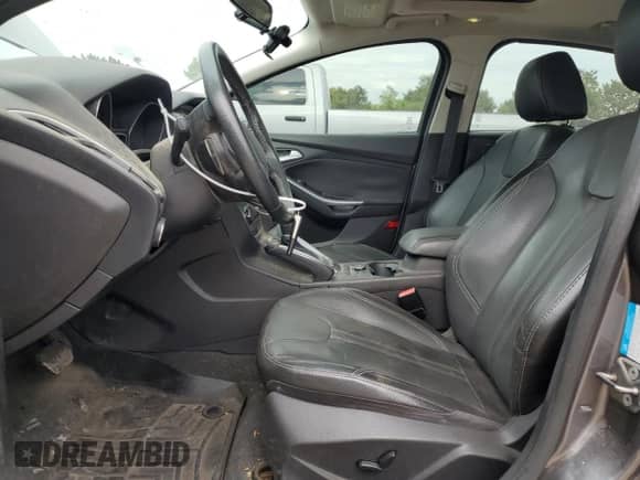 2013 Ford Focus Titanium z VIN 1FADP3N22DL231906, wystawiony jako Copart lot #81408625 z przebiegiem 99 991 mil mil oraz Szkoda całkowita • Salvage title. Historia ofert i sprzedaży dostępna na DreamBid. Obrazek 7.