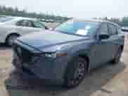 2023 Mazda CX-5 S Carbon Edition z VIN JM3KFBCM5P0179462, wystawiony jako IAAI lot #42451109 z przebiegiem 14 170 mil mil oraz . Historia ofert i sprzedaży dostępna na DreamBid. Obrazek 2.