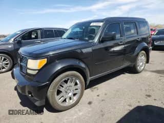 2011 Dodge Nitro Heat with VIN 1D4PT4GX6BW506192, listed as a Copart auction lot 58795955 with 231,377 mi miles and Salvage title. Bid and sale history available at DreamBid. Image 1.