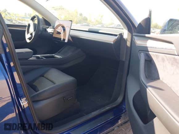 2023 Tesla Model Y Long Range with VIN 7SAYGDEE4PA125024, listed as a IAAI auction lot 43252218 with 21,200 mi miles and . Bid and sale history available at DreamBid. Image 5.