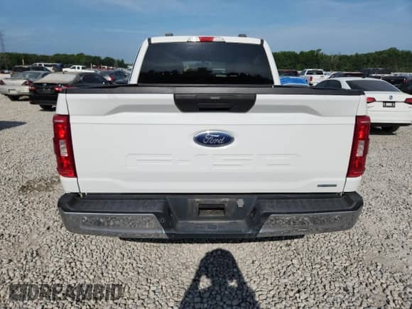 2023 Ford F-150 Lariat with VIN 1FTFW1E89PFA91516, listed as a Copart auction lot 61666315 with 65,711 mi miles and Salvage title. Bid and sale history available at DreamBid. Image 6.