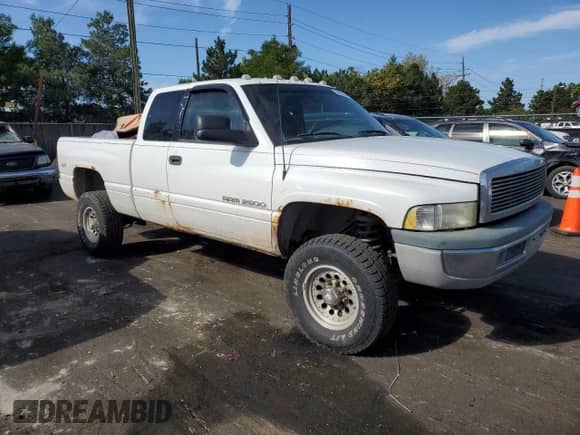 1998 Dodge 2500 with VIN 3B7KF22Z3WG105585, listed as a Copart auction lot 68866854 with 181,466 mi miles and Salvage title. Bid and sale history available at DreamBid. Image 4.