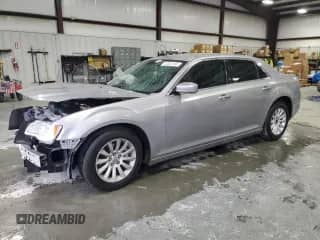 2014 Chrysler 300 с VIN 2C3CCAAGXEH163235, выставлен на аукционе Copart как лот 67244155 с пробегом 116 213 миль миль и Списание • Salvage title. История ставок и продаж доступна на DreamBid. Изображение 1.