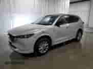 2025 Mazda CX-5 S Select z VIN JM3KFBBLXS0670644, wystawiony jako Copart lot #84252345 z przebiegiem Nie podano mil oraz Nie do naprawy • Non repairable. Historia ofert i sprzedaży dostępna na DreamBid. Obrazek 1.