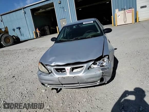 2003 Pontiac Grand Am SE1 with VIN 1G2NF52E13M550724, listed as a Copart auction lot 56990665 with 214,603 mi miles and Salvage title. Bid and sale history available at DreamBid. Image 13.