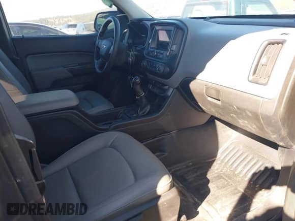 2019 Chevrolet Colorado 2WD WT z VIN 1GCHSAEA2K1184892, wystawiony jako IAAI lot #43216739 z przebiegiem 50 266 mil mil oraz . Historia ofert i sprzedaży dostępna na DreamBid. Obrazek 5.