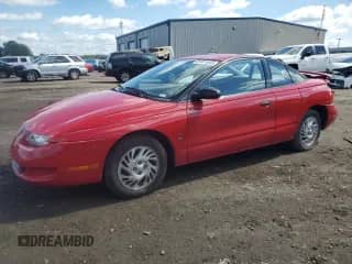 1999 Saturn SC с VIN 1G8ZP128XXZ252270, выставлен на аукционе Copart как лот 81371645 с пробегом 76 945 миль миль и Списание • Salvage title. История ставок и продаж доступна на DreamBid. Изображение 1.