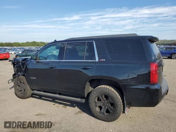 2019 Chevrolet Tahoe LT with VIN 1GNSKBKC6KR291633, listed as a Copart auction lot 80287665 with 84,643 mi miles and Salvage title. Bid and sale history available at DreamBid. Image 2.