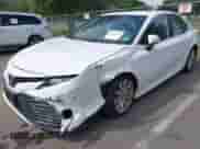 2020 Toyota Camry LE with VIN 4T1L11AKXLU329121, listed as a IAAI auction lot 43233720 with 46,485 mi miles and . Bid and sale history available at DreamBid. Image 2.