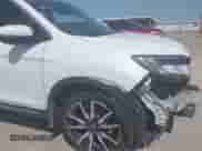 2022 Honda Pilot Elite with VIN 5FNYF6H03NB088592, listed as a IAAI auction lot 42903811 with 55,976 mi miles and . Bid and sale history available at DreamBid. Image 21.