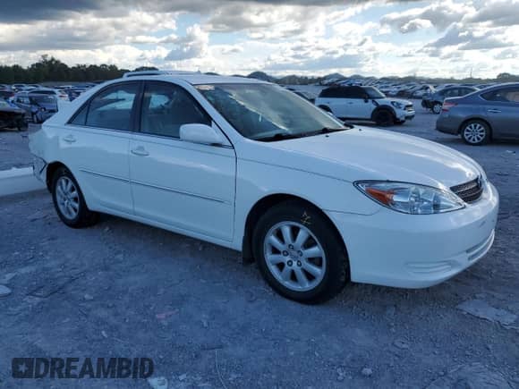 2002 Toyota Camry XLE z VIN 4T1BE32K52U112567, wystawiony jako Copart lot #84189535 z przebiegiem 154 151 mil mil oraz Szkoda całkowita • Salvage title. Historia ofert i sprzedaży dostępna na DreamBid. Obrazek 4.
