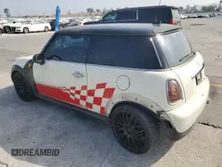 2007 MINI Hardtop with VIN WMWMF33547TT51590, listed as a Copart auction lot 57323995 with 114,113 mi miles and Salvage title. Bid and sale history available at DreamBid. Image 2.