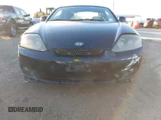 2006 Hyundai Tiburon GS z VIN KMHHM65DX6U217882, wystawiony jako IAAI lot #43576572 z przebiegiem 158 336 mil mil oraz . Historia ofert i sprzedaży dostępna na DreamBid. Obrazek 6.