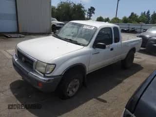 2000 Toyota Tacoma z VIN 4TAWM72N7YZ650270, wystawiony jako Copart lot #61074565 z przebiegiem 275 042 mil mil oraz Szkoda całkowita • Salvage title. Historia ofert i sprzedaży dostępna na DreamBid. Obrazek 1.