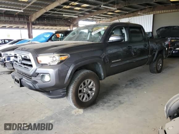 2017 Toyota Tacoma SR5 with VIN 3TMDZ5BNXHM027664, listed as a Copart auction lot 65009735 with 76,227 mi miles and Salvage title. Bid and sale history available at DreamBid. Image 1.
