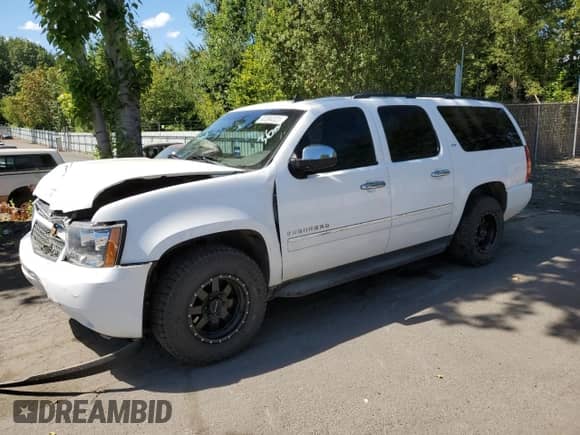 2013 Chevrolet Suburban LTZ с VIN 1GNSKKE7XDR183758, выставлен на аукционе Copart как лот 63390323 с пробегом 127 433 миль миль и Списание • Salvage title. История ставок и продаж доступна на DreamBid. Изображение 1.