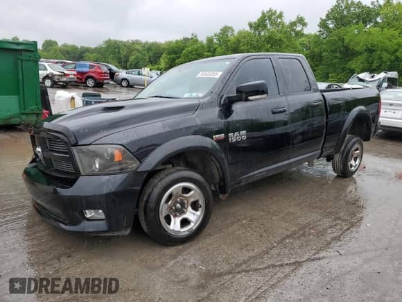 2012 Ram 1500 Sport with VIN 1C6RD7HT0CS345113, listed as a Copart auction lot 56533355 with 146,767 mi miles and Salvage title. Bid and sale history available at DreamBid. Image 1.