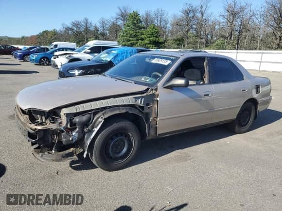 1996 Toyota Camry DX z VIN 4T1BG12K1TU751173, wystawiony jako Copart lot #69909135 z przebiegiem 134 247 mil mil oraz Szkoda całkowita • Salvage title. Historia ofert i sprzedaży dostępna na DreamBid. Obrazek 1.