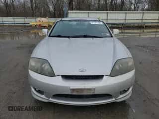 2006 Hyundai Tiburon GS с VIN KMHHM65D96U222152, выставлен на аукционе Copart как лот 85370164 с пробегом 58 892 миль миль и Чистый • Clean title. История ставок и продаж доступна на DreamBid. Изображение 5.