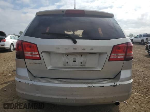 2013 Dodge Journey American Value с VIN 3C4PDCAB5DT701064, выставлен на аукционе Copart как лот 82046285 с пробегом Не указан миль и Списание • Salvage title. История ставок и продаж доступна на DreamBid. Изображение 6.