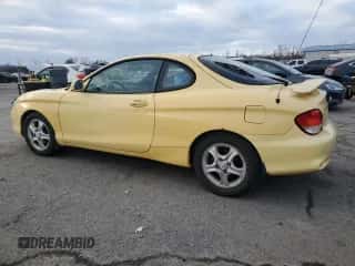 2001 Hyundai Tiburon с VIN KMHJG35F01U231789, выставлен на аукционе Copart как лот 88988265 с пробегом 106 946 миль миль и Чистый • Clean title. История ставок и продаж доступна на DreamBid. Изображение 2.