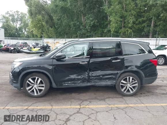 2017 Honda Pilot Touring z VIN 5FNYF6H96HB055928, wystawiony jako IAAI lot #42955822 z przebiegiem 97 085 mil mil oraz . Historia ofert i sprzedaży dostępna na DreamBid. Obrazek 14.