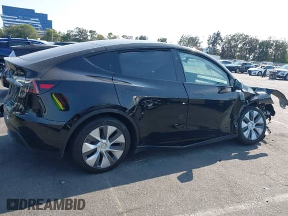 2023 Tesla Model Y Long Range z VIN 7SAYGAEE9PF851348, wystawiony jako IAAI lot #43167064 z przebiegiem Nie podano mil oraz . Historia ofert i sprzedaży dostępna na DreamBid. Obrazek 13.