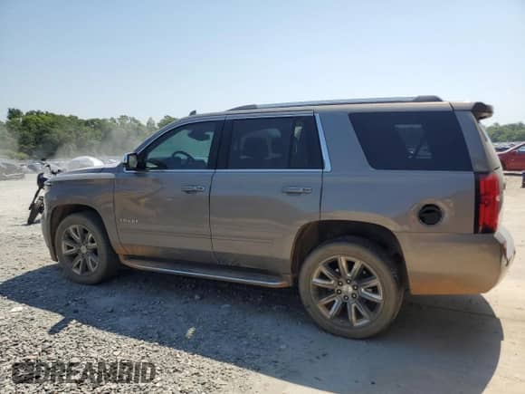 2017 Chevrolet Tahoe Premier with VIN 1GNSCCKC3HR356675, listed as a Copart auction lot 61758905 with 142,657 mi miles and Salvage title. Bid and sale history available at DreamBid. Image 2.