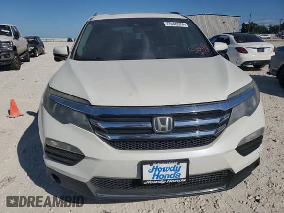 2017 Honda Pilot Touring с VIN 5FNYF6H90HB089380, выставлен на аукционе Copart как лот 77048374 с пробегом 198 426 миль миль и Чистый • Clean title. История ставок и продаж доступна на DreamBid. Изображение 5.