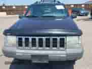 1996 Jeep Grand Cherokee Laredo z VIN 1J4GZ58Y2TC354076, wystawiony jako IAAI lot #42572842 z przebiegiem 172 282 mil mil oraz . Historia ofert i sprzedaży dostępna na DreamBid. Obrazek 6.