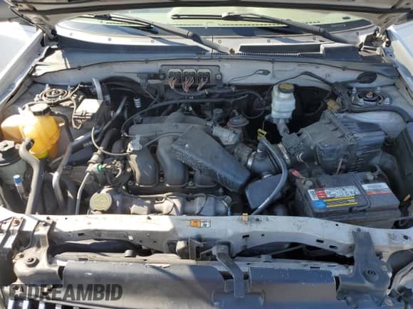 2007 Mercury Mariner Premier with VIN 4M2CU97107KJ12925, listed as a Copart auction lot 62371895 with 141,576 mi miles and Salvage title. Bid and sale history available at DreamBid. Image 12.